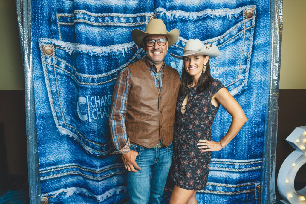 Everardo of Photo Fusion Studio with his wife Nicole at the denim photo backdrop, Chandler Chamber Community Awards
