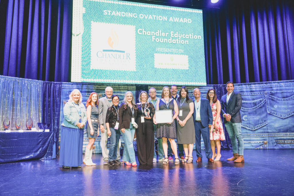 Chandler Education Foundation team accepts the Standing Ovation Award on stage at the Chandler Chamber Community Awards