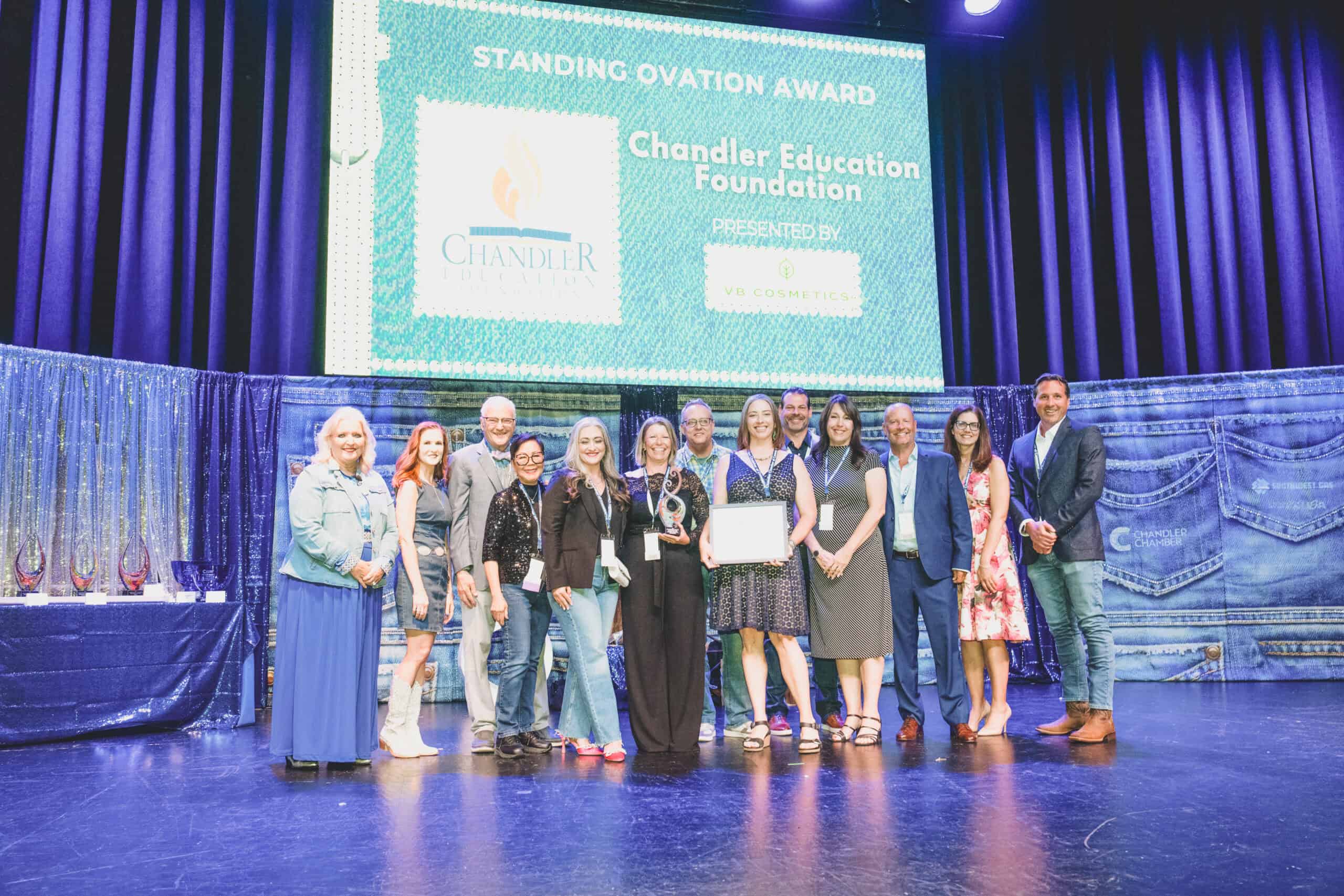 Chandler Education Foundation team accepts the Standing Ovation Award on stage at the Chandler Chamber Community Awards