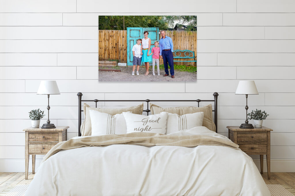 family portrait canvas on wall above bed