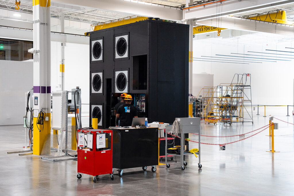 Large XNRGY data center cooling unit with array of fans on the production floor at the Mesa Gateway facility.